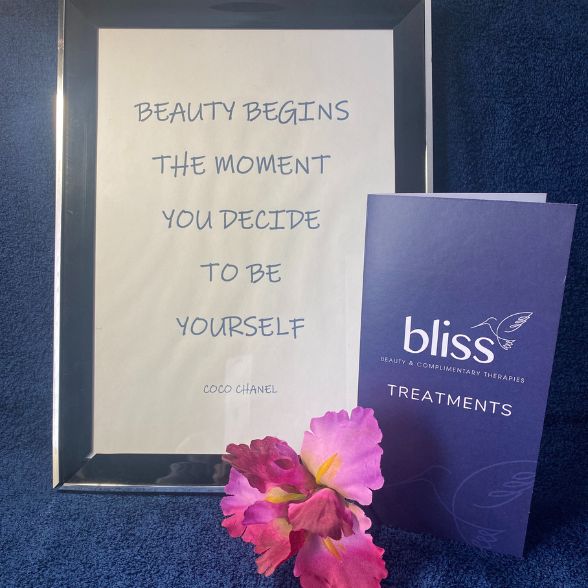 Besuty begins - Bliss Therapy Frodsham Bliss Therapy Frodsham treatments leaflet with a framed Coco Chanel quote saying ‘Beauty begins the moment you decide to be yourself’ and a pink flower.